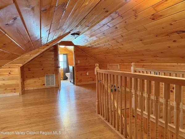 a view of a balcony with wooden floor