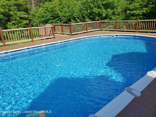 a view of a yard with wooden floor
