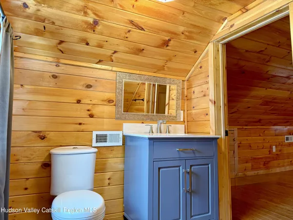 a bathroom with a toilet and shower
