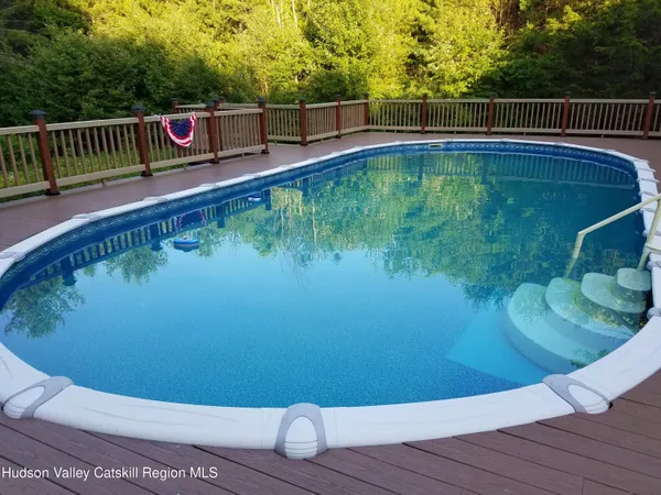 a view of a swimming pool with a back yard