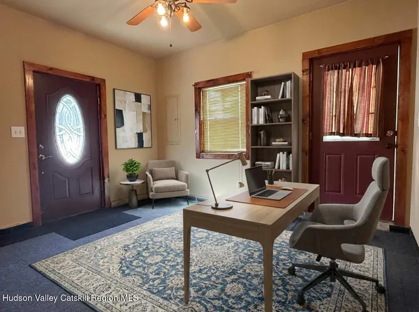 a workspace with furniture and window