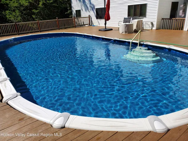a view of swimming pool with seating space