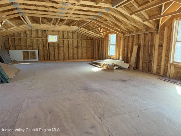 a view of a room with wooden walls