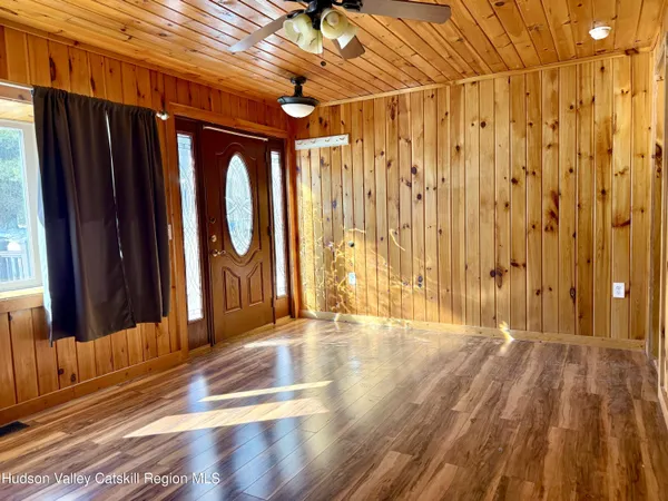 a view of wooden door with glass door