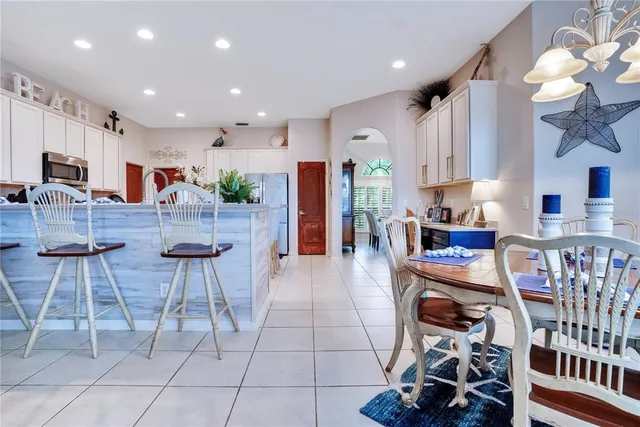 a living room with lots of furniture and a chandelier
