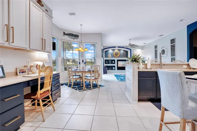 a kitchen with stainless steel appliances kitchen island granite countertop a sink and cabinets