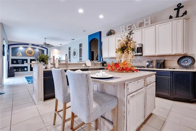 a kitchen with stainless steel appliances granite countertop a stove and a microwave