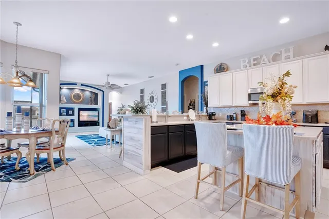 a bathroom with a sink a toilet and shower curtain