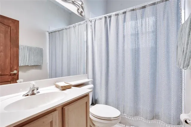 a bedroom with a bed and a table in it