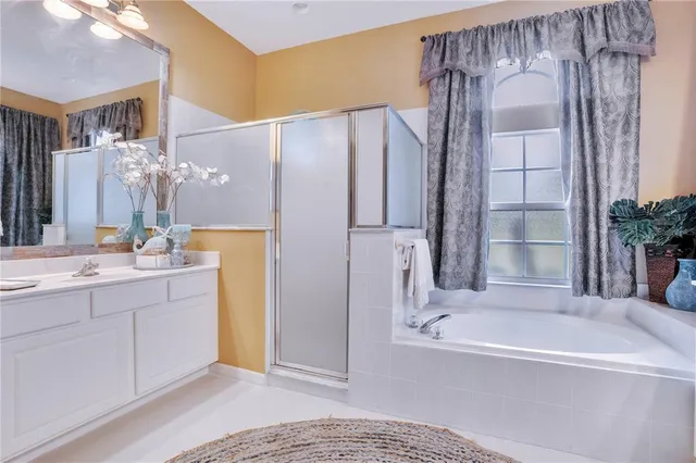 a view of a kitchen with stove and white cabinets