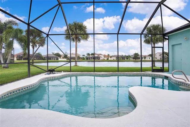 a view of a house with a yard and sitting area