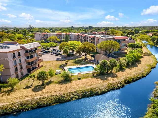 an aerial view of a house with a ocean view