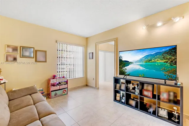 a view of a living room and dining room