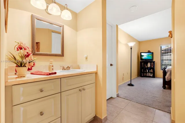 a bathroom with a shower and a sink