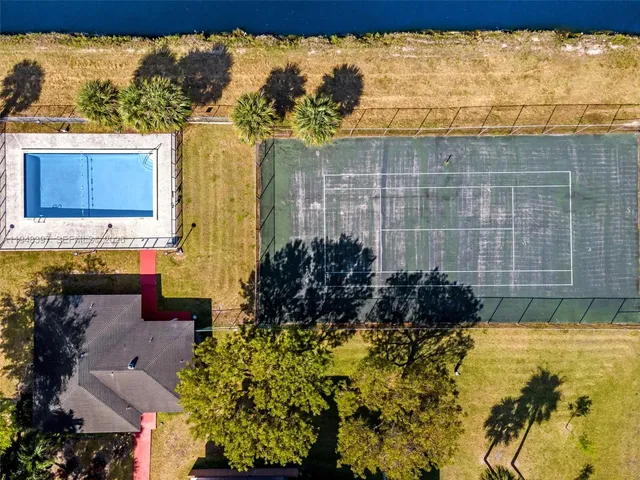 a view of a large building with a yard