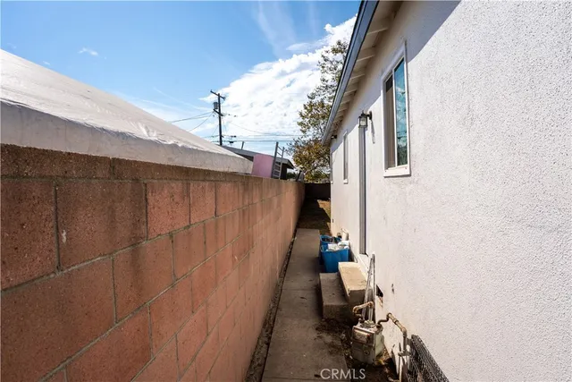 a view of stairs and utility room with stairs
