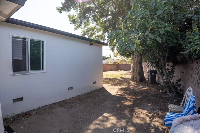 a view of a house with a tree