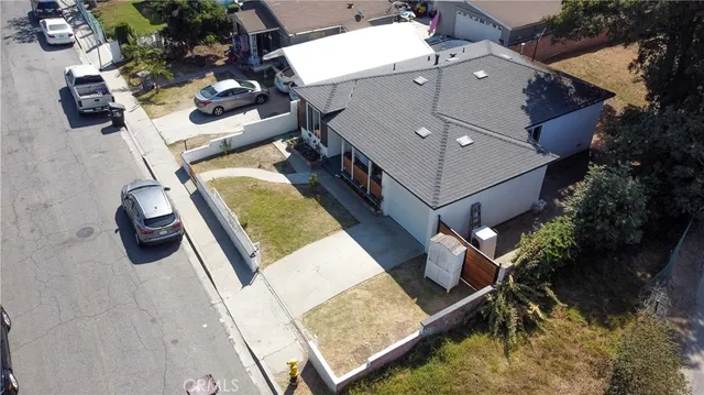 an aerial view of a house with a swimming pool