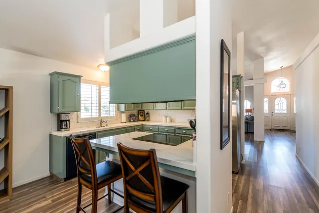 a kitchen with a table and chairs