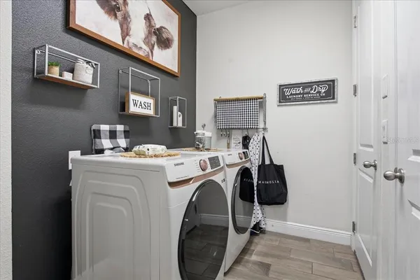 a view of storage and utility room with washer and dryer
