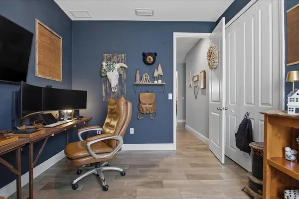 a room with furniture and a flat screen tv