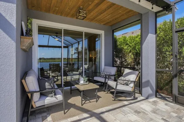 a building outdoor space with patio furniture and potted plants