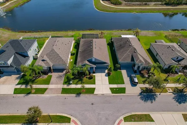 an aerial view of house with yard swimming pool and outdoor seating