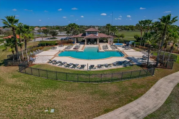 swimming pool view with a seating space