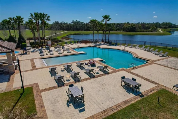a view of a swimming pool with a patio