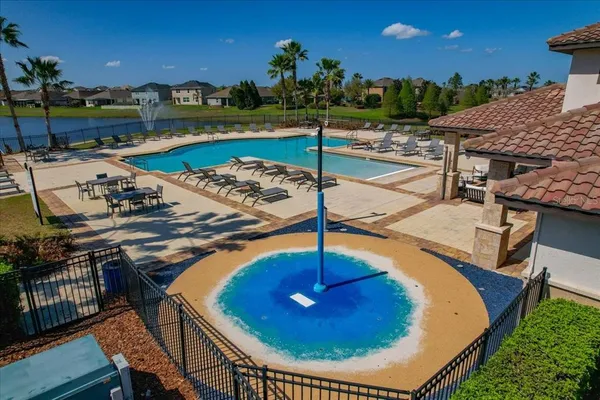 a view of a lake with couches and city view