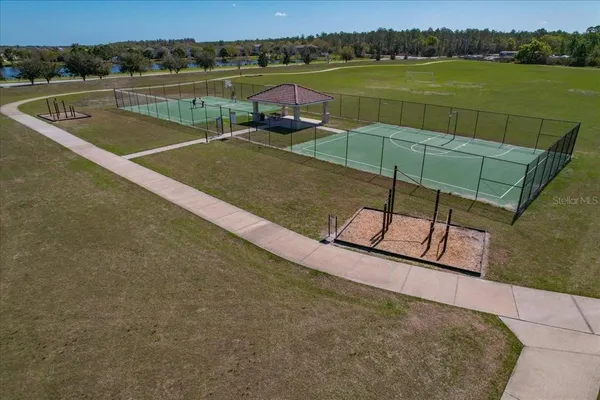 a view of a wrought iron fences in front of house