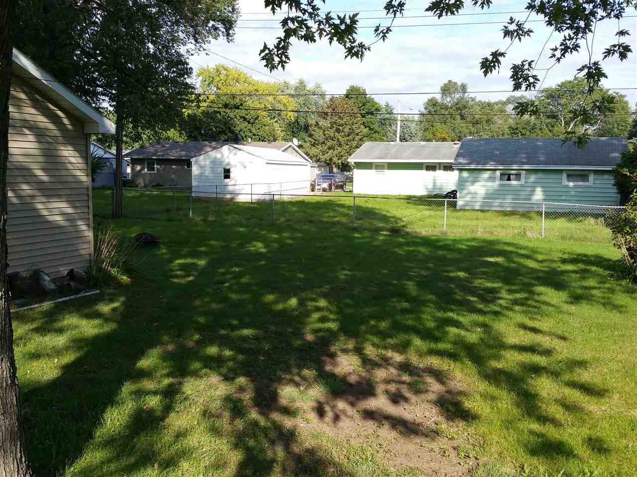 7809 Randy Road Machesney Park, IL 61115 - Photo 16 of 20 a view of a house with a yard