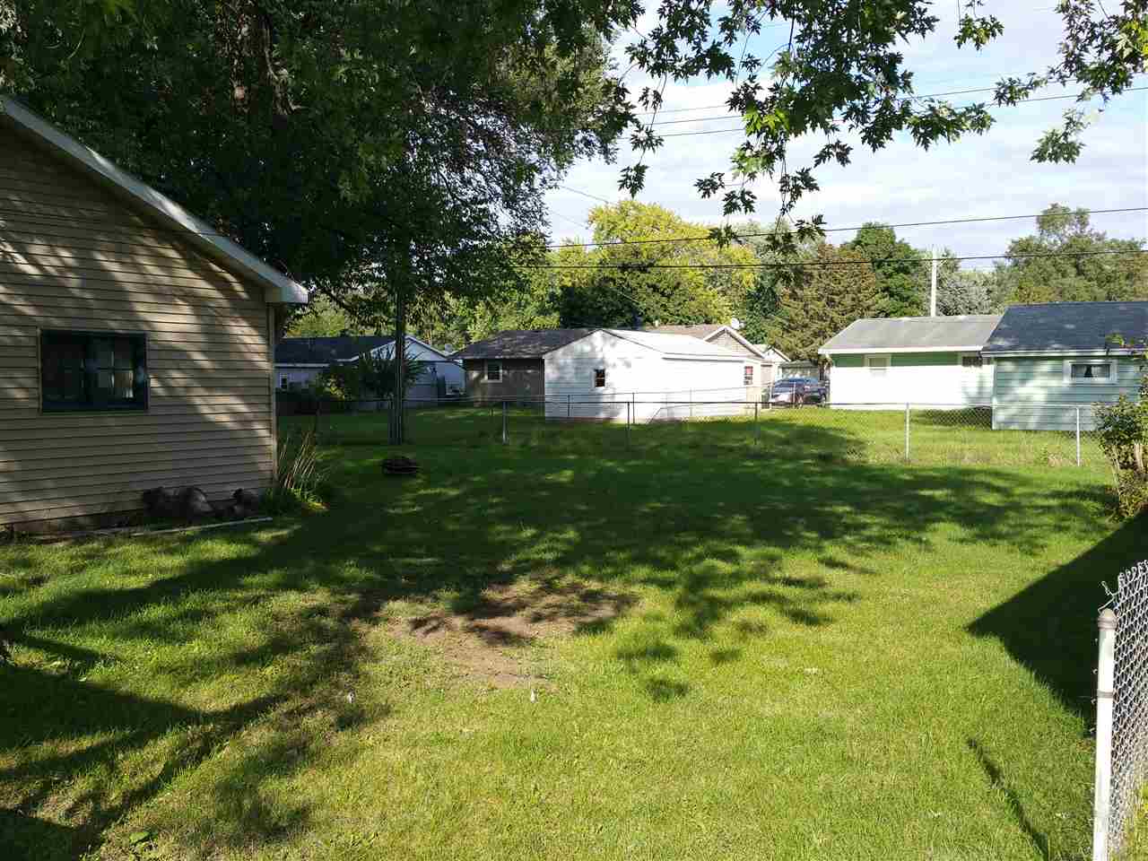 7809 Randy Road Machesney Park, IL 61115 - Photo 17 of 20 a view of a house with a yard