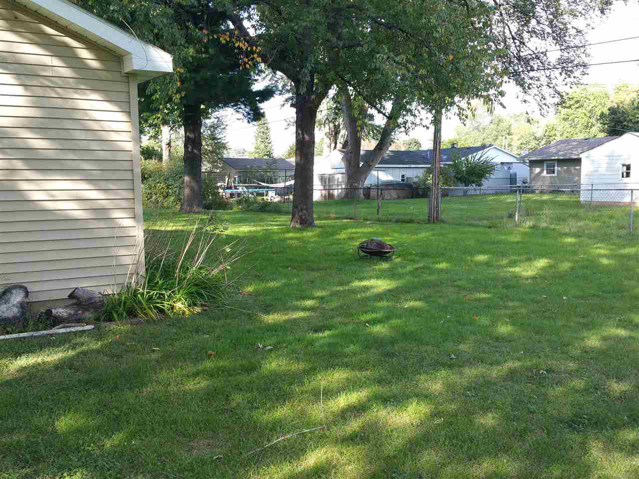 7809 Randy Road Machesney Park, IL 61115 - Photo 18 of 20 a view of a backyard with a garden