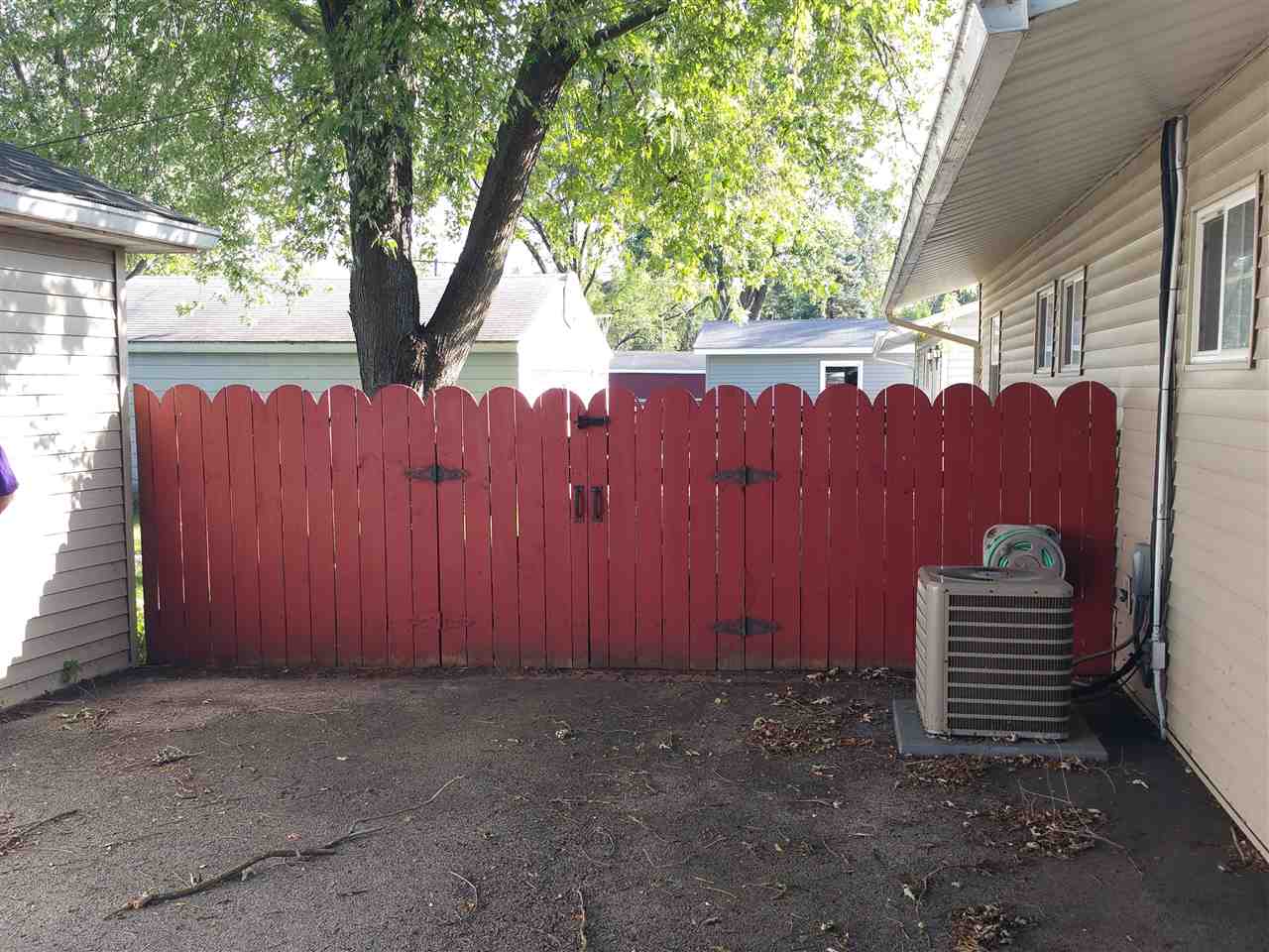 7809 Randy Road Machesney Park, IL 61115 - Photo 20 of 20 a backyard of a house with a table and chairs