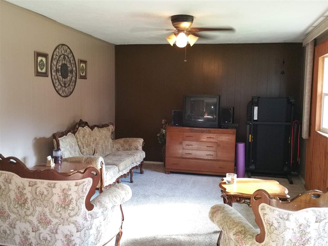 7809 Randy Road Machesney Park, IL 61115 - Photo 2 of 20 a bedroom with a bed and a chandelier