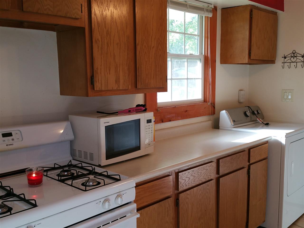 7809 Randy Road Machesney Park, IL 61115 - Photo 9 of 20 a kitchen with stainless steel appliances a sink stove and cabinets