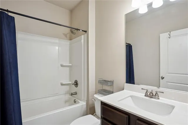 a bed room with a bed and a chair