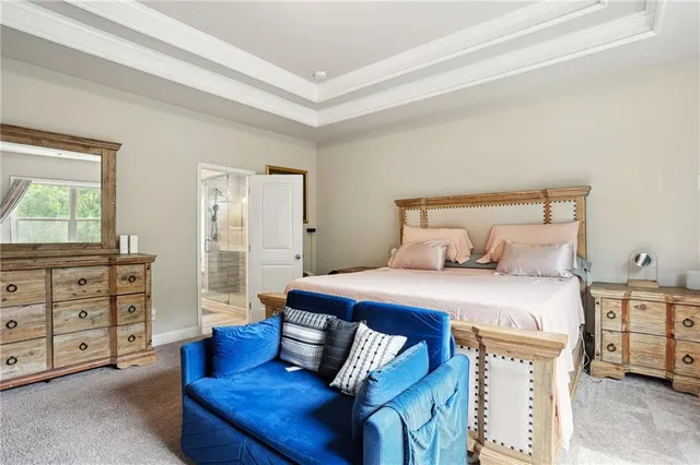 a bathroom with a glass shower door and a sink