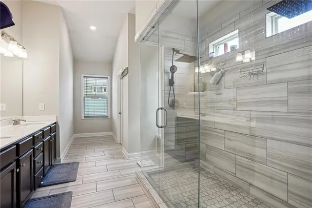 a bathroom with a sink double vanity and a mirror