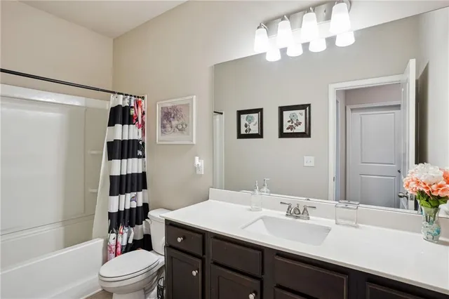 a bedroom with a bed and dresser