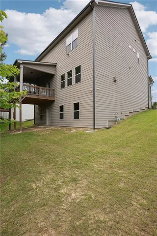a backyard of a house with lots of green space
