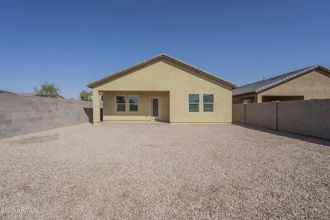 a view of a house with a yard and garage