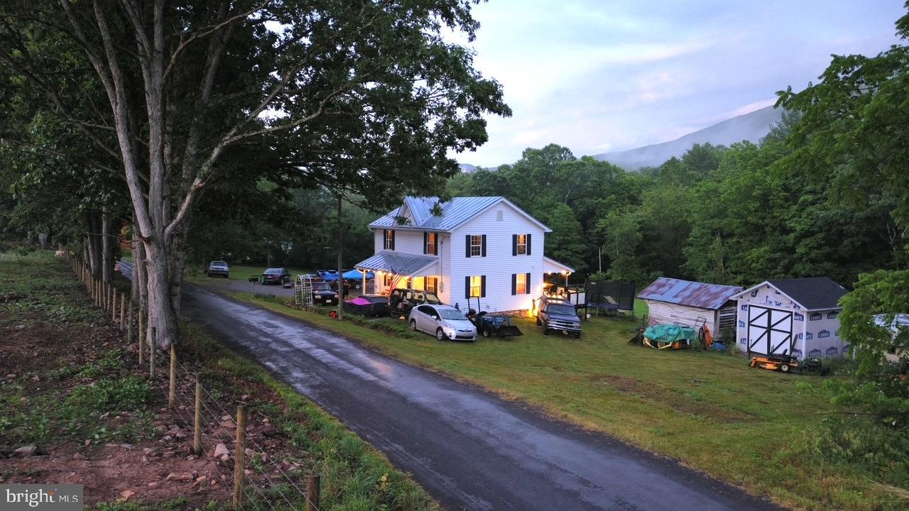 2600 Middle Cove Road Mathias, WV 26812 - Photo 8 of 30 a front view of a house with garden