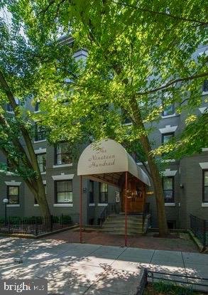 1900 S Street Northwest, Unit 4 Washington, DC 20009 - Photo 12 of 12 a front view of a house with a yard