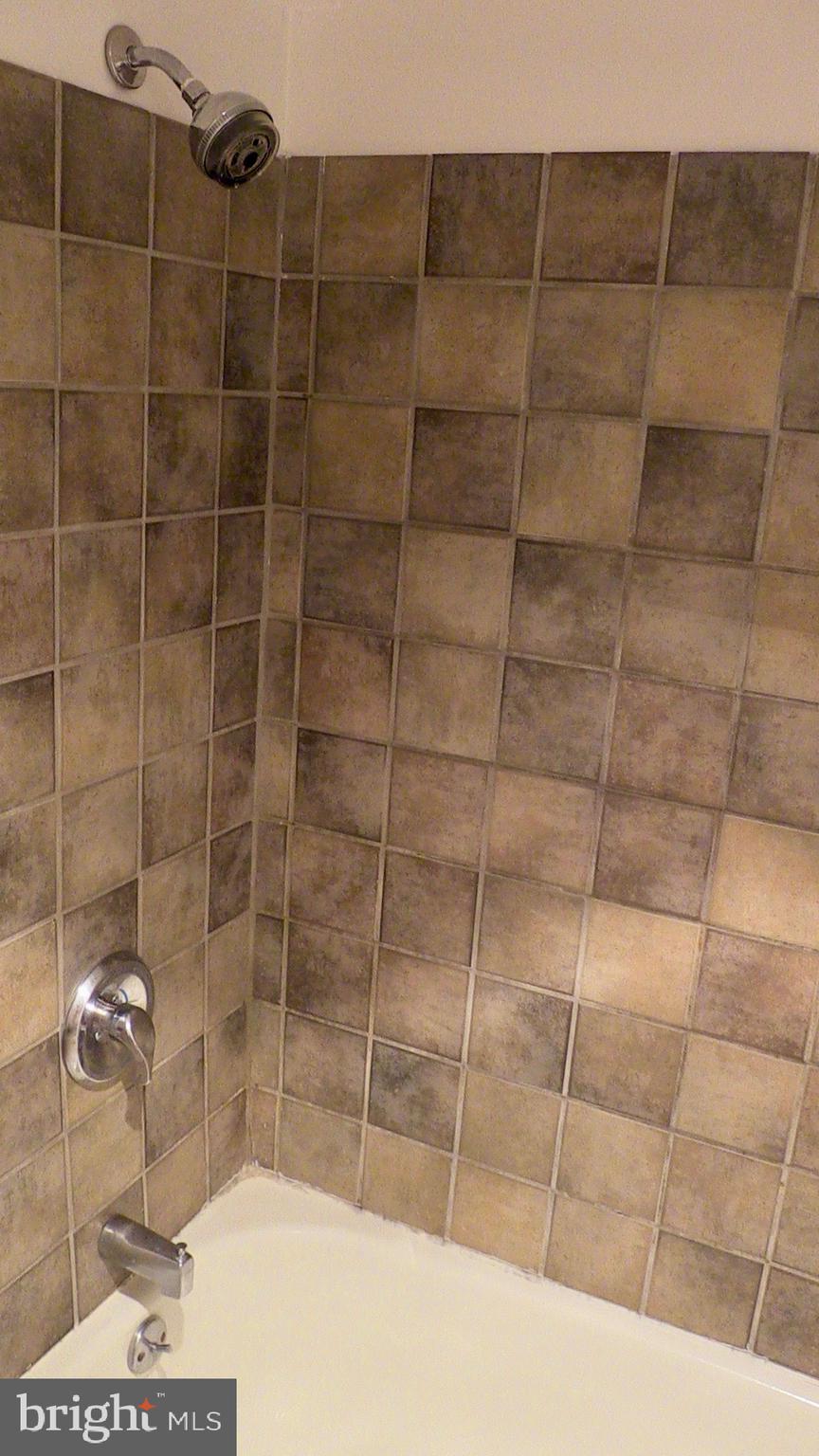 1900 S Street Northwest, Unit 4 Washington, DC 20009 - Photo 7 of 12 a bathroom with a shower