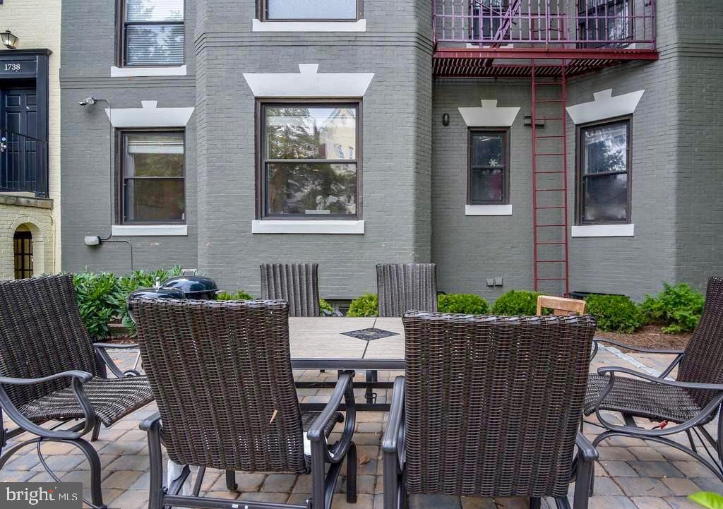 1900 S Street Northwest, Unit 4 Washington, DC 20009 - Photo 9 of 12 a view of a patio with table and chairs