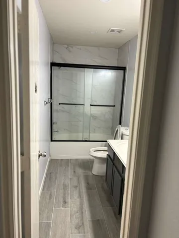 a bathroom with a sink and toilet