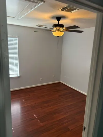a view of a small space with wooden floor