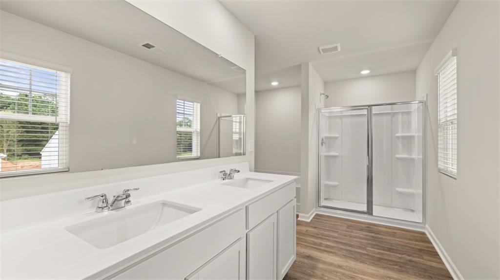 97 Defilippe Drive Statham, GA 30666 - Photo 16 of 58 a bathroom with a double vanity sink mirror and double